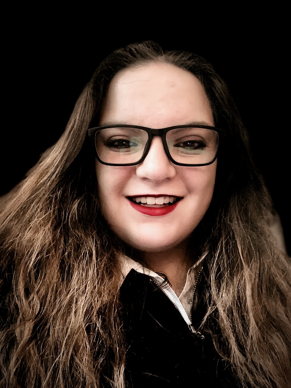 A photo of me Lydia Csaszar all dress up with my nice glasses and spiffy red lipstain.